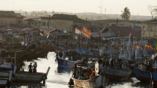 Fishing boats sit in the harbor as the motorcade that carries the media covering US first lady Melania Trump passes in Accra, Ghana, October 2, 2018. - Sputnik International