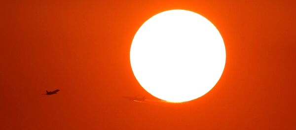 Two planes fly in front of the setting sun in Shanghai, China October 2, 2018 - Sputnik International
