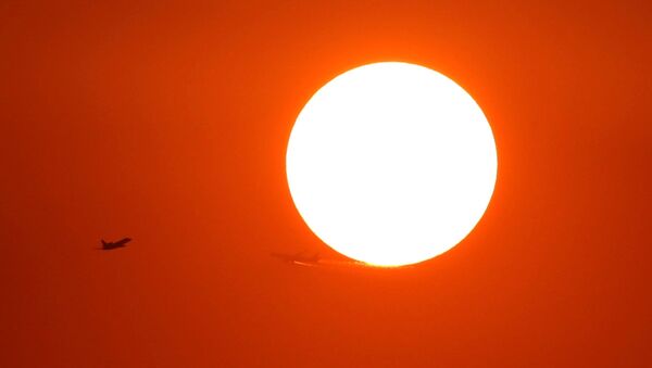 Two planes fly in front of the setting sun in Shanghai, China October 2, 2018 - Sputnik International
