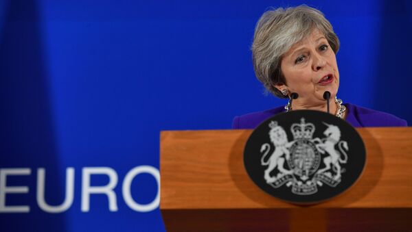 Britain's Prime Minister Theresa May addresses a press conference on the sidelines of a EU summit at the European Council in Brussels on October 18, 2018. - Sputnik International
