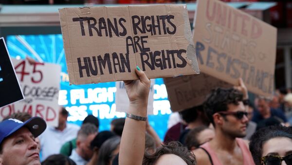 People protest U.S. President Donald Trump's announcement that he plans to reinstate a ban on transgender individuals from serving in any capacity in the U.S. military, in Times Square, in New York City, New York, U.S (File) - Sputnik International