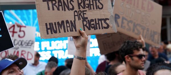 People protest U.S. President Donald Trump's announcement that he plans to reinstate a ban on transgender individuals from serving in any capacity in the U.S. military, in Times Square, in New York City, New York, U.S (File) - Sputnik International
