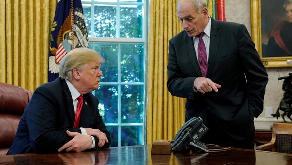 U.S. President Donald Trump speaks to White House Chief of Staff John Kelly after an event with reporters in the Oval Office at the White House in Washington, U.S. October 10, 2018 - Sputnik International
