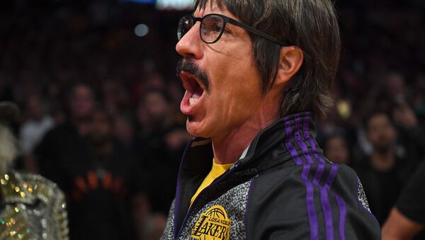 Anthony Kiedis, lead singer of the band Red Hot Chili Peppers, yells profanities at Houston Rockets guard Chris Paul (not pictured) as he is escorted off the floor after he was ejected from the fourth quarter of the game against the Los Angeles Lakers at Staples Center. - Sputnik International