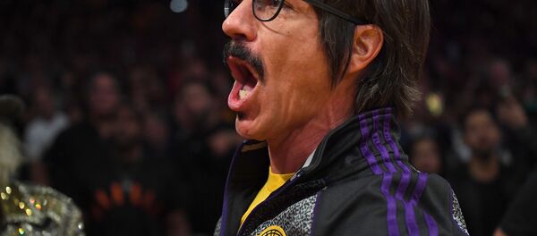 Anthony Kiedis, lead singer of the band Red Hot Chili Peppers, yells profanities at Houston Rockets guard Chris Paul (not pictured) as he is escorted off the floor after he was ejected from the fourth quarter of the game against the Los Angeles Lakers at Staples Center. Anthony Kiedis, lead singer of the band Red Hot Chili Peppers, yells profanities at Houston Rockets guard Chris Paul (not pictured) as he is escorted off the floor after he was ejected from the fourth quarter of the game against the Los Angeles Lakers at Staples Center. - Sputnik International