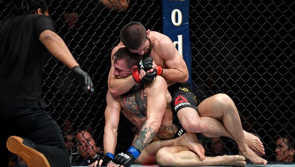 Oct 6, 2018; Las Vegas, NV, USA; Khabib Nurmagomedov (red gloves) fights Conor McGregor (blue gloves) during UFC 229 at T-Mobile Arena: - Sputnik International