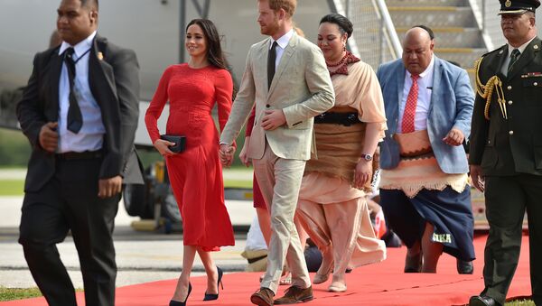 Britain's Prince Harry and his wife Meghan, Duchess of Sussex arrive at Fua'amotu airport in Tonga on October 25, 2018. Prince Harry and his pregnant wife Meghan left Fiji after a three-day official visit and arrived in Tonga as part of their tour of Australia and the South Pacific. - Sputnik International