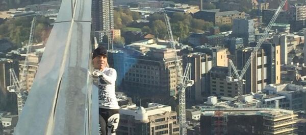 Alain Robert, known as 'Spiderman', climbs the Heron Tower in London - Sputnik International