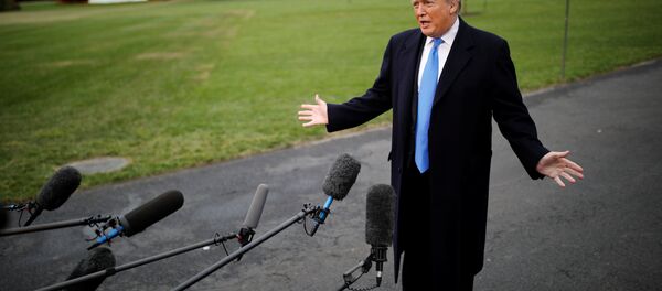 U.S. President Donald Trump talks to reporters as he departs for campaign travel to North Carolina from the White House in Washington, U.S., October 22, 2018. - Sputnik International