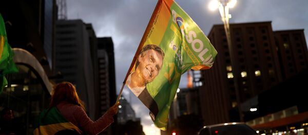 Supporters of Jair Bolsonaro, far-right lawmaker and presidential candidate of the Social Liberal Party (PSL), react during a runoff election in Sao Paulo, Brazil October 28, 2018 Supporters of Jair Bolsonaro, far-right lawmaker and presidential candidate of the Social Liberal Party (PSL), react during a runoff election in Sao Paulo, Brazil October 28, 2018 - Sputnik International