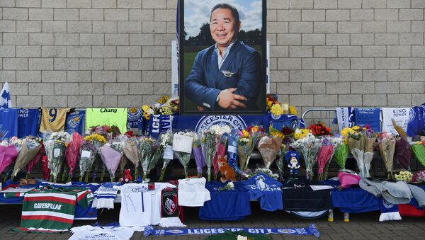 A portrait of Leicester City Football Club's Thai chairman Vichai Srivaddhanaprabha, who died in a helicopter crash at the club's stadium, is seen amid flowers and tributes outside the King Power Stadium in Leicester, eastern England, on October 29, 2018 - Sputnik International