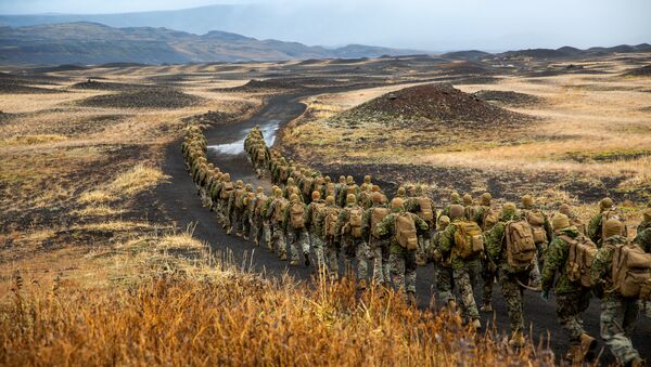 U.S. Marines with the 24th Marine Expeditionary Unit, deployed during Exercise Trident Juncture 18, hike to a cold-weather training site inland in Iceland, October 19, 2018. Picture taken October 19, 2018 - Sputnik International