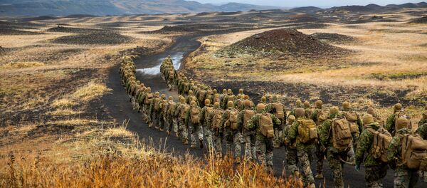 U.S. Marines with the 24th Marine Expeditionary Unit, deployed during Exercise Trident Juncture 18, hike to a cold-weather training site inland in Iceland, October 19, 2018. Picture taken October 19, 2018 - Sputnik International