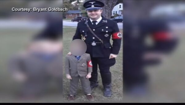 Bryant Goldbach of Owensboro, Kentucky wears a Nazi soldier-style costume for Halloween with his son, 5, dressed as Adolf Hitler. - Sputnik International