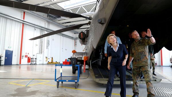 German Defence Minister Ursula von der Leyen is pictured next to a German Bundeswehr armed forces Sikorsky CH-53 helicopter of the Helicopter Wing 64 during her visit at Holzdorf Air Base, south of Berlin, Germany, July 24, 2018 - Sputnik International