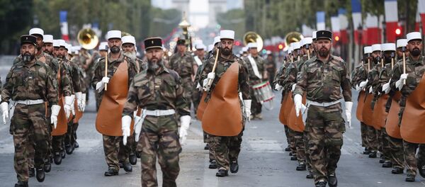 Soldiers of the French Foreign Legion parade on the Champs Elysees avenue during a rehearsal for Bastille Day, early Wednesday, July 11, 2018 in Paris. Soldiers of the French Foreign Legion parade on the Champs Elysees avenue during a rehearsal for Bastille Day, early Wednesday, July 11, 2018 in Paris. - Sputnik International