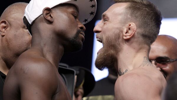Boxer Floyd Mayweather Jr. (L) and MMA figher Connor Mcgregor pose during their weigh- in on August 25, 2017, in Las Vegas, Nevada - Sputnik International