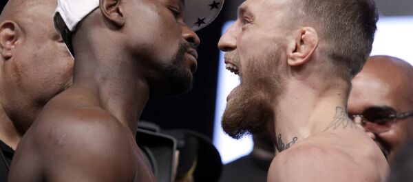 Boxer Floyd Mayweather Jr. (L) and MMA figher Connor Mcgregor pose during their weigh- in on August 25, 2017, in Las Vegas, Nevada Boxer Floyd Mayweather Jr. (L) and MMA figher Connor Mcgregor pose during their weigh- in on August 25, 2017, in Las Vegas, Nevada - Sputnik International