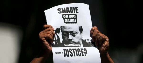 A member of Sri Lankan web journalist association holds a placard during a protest condemning the murder of slain journalist Jamal Khashoggi in front of the Saudi Embassy in Colombo, Sri Lanka October 25, 2018 A member of Sri Lankan web journalist association holds a placard during a protest condemning the murder of slain journalist Jamal Khashoggi in front of the Saudi Embassy in Colombo, Sri Lanka October 25, 2018 - Sputnik International