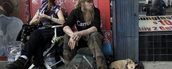 In this Oct. 1, 2018 photo, Stormy Nichole Day, left, sits on a sidewalk on Haight Street with Nord (last name not given) and his dog Hobo while interviewed about being homeless in San Francisco In this Oct. 1, 2018 photo, Stormy Nichole Day, left, sits on a sidewalk on Haight Street with Nord (last name not given) and his dog Hobo while interviewed about being homeless in San Francisco - Sputnik International