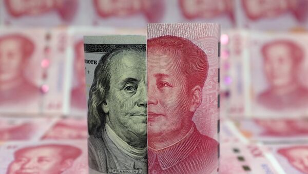 A Benjamin Franklin U.S. 100-dollar banknote and a Chinese 100-yuan banknote depicting late Chinese chairman Mao Zedong are seen in a picture illustration taken January 21, 2016 - Sputnik International