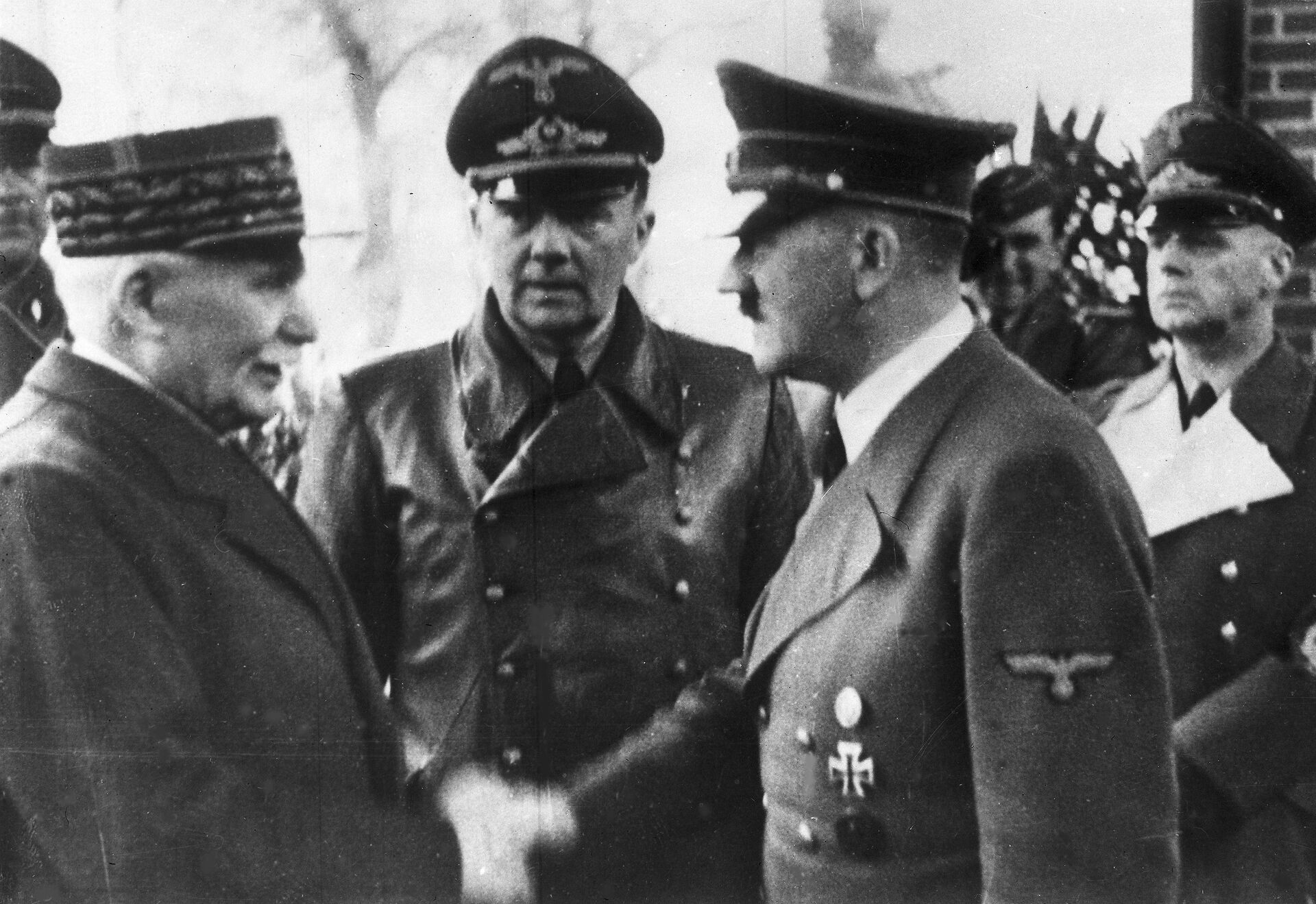 This Oct. 24, 1940 file photo shows German Chancellor Adolf Hitler, right, shaking hands with Head of State of Vichy France Marshall Philippe Petain, in occupied France.  - Sputnik International, 1920, 19.10.2021