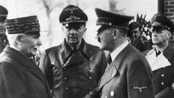 This Oct. 24, 1940 file photo shows German Chancellor Adolf Hitler, right, shaking hands with Head of State of Vichy France Marshall Philippe Petain, in occupied France. - Sputnik International