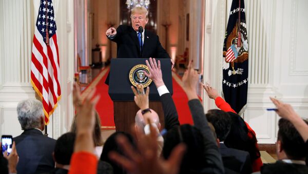 U.S. President Donald Trump points to a questioner while taking questions during a news conference following Tuesday's midterm congressional elections at the White House in Washington, U.S., November 7, 2018 - Sputnik International