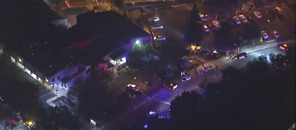 In this image made from aerial video, police vehicles line a road in the vicinity of a shooting in Thousand Oaks, California, early Thursday, Nov. 8, 2018 - Sputnik International