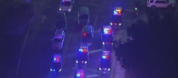 In this image made from aerial video, police vehicles block an intersection in the vicinity of a shooting in Thousand Oaks, California, early Thursday, Nov. 8, 2018 - Sputnik International