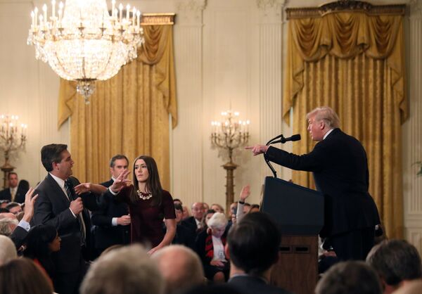 A White House staff member reaches for the microphone held by CNN's Jim Acosta as he questions U.S. President Donald Trump during a news conference following Tuesday's midterm U.S. congressional elections at the White House in Washington, U.S., November 7, 2018 A White House staff member reaches for the microphone held by CNN's Jim Acosta as he questions U.S. President Donald Trump during a news conference following Tuesday's midterm U.S. congressional elections at the White House in Washington, U.S., November 7, 2018 - Sputnik International