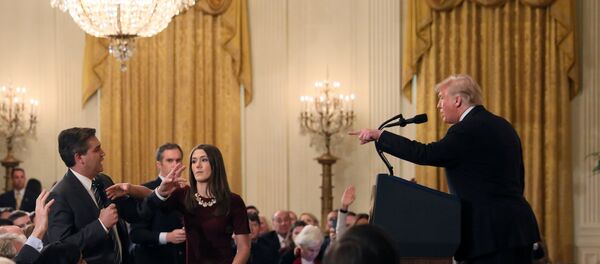 A White House staff member reaches for the microphone held by CNN's Jim Acosta as he questions U.S. President Donald Trump during a news conference following Tuesday's midterm U.S. congressional elections at the White House in Washington, U.S., November 7, 2018 A White House staff member reaches for the microphone held by CNN's Jim Acosta as he questions U.S. President Donald Trump during a news conference following Tuesday's midterm U.S. congressional elections at the White House in Washington, U.S., November 7, 2018 - Sputnik International