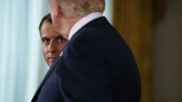 French President Emmanuel Macron listens as President Donald Trump speaks during a news conference in the East Room of the White House, Tuesday, April 24, 2018, in Washington. (AP Photo/Evan Vucci) - Sputnik International