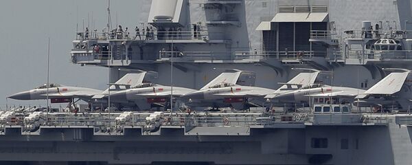 The Liaoning, China's first aircraft carrier, departs Hong Kong - Sputnik International
