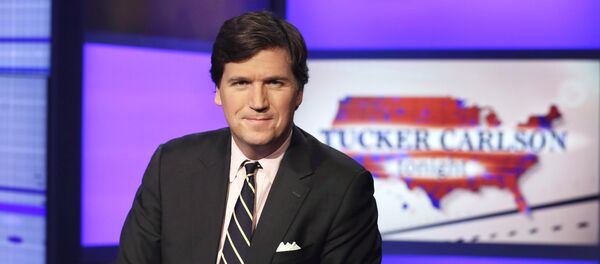 Tucker Carlson, host of Tucker Carlson Tonight, poses for photos in a Fox News Channel studio, in New York, Thursday, March 2, 2107. - Sputnik International