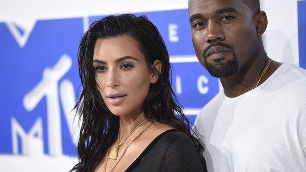 Kim Kardashian West, left, and Kanye West arrive at the MTV Video Music Awards at Madison Square Garden on Sunday, Aug. 28, 2016, in New York. - Sputnik International