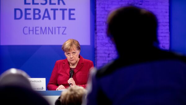 German Chancellor Angela Merkel speaks during the meeting with readers of 'Freie Presse' newspaper in Chemnitz - Sputnik International