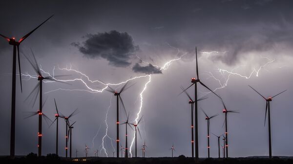 In this Aug. 1, 2017 photo lightning illuminate the night sky over the Odervorland wind farm in the Oder-Spree district near to Sieversdorf, Germany. - Sputnik International