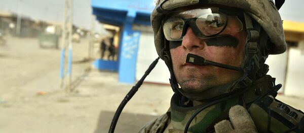 U.S. Marine Sgt. Derek McGee, of Rhinebeck, New York, speaks into his radio during a patrol in Fallujah, the site of the largest U.S. battle in Iraq, 65 kilometers (40 miles), west of Baghdad, Iraq, Monday, May 1, 2006 U.S. Marine Sgt. Derek McGee, of Rhinebeck, New York, speaks into his radio during a patrol in Fallujah, the site of the largest U.S. battle in Iraq, 65 kilometers (40 miles), west of Baghdad, Iraq, Monday, May 1, 2006 - Sputnik International
