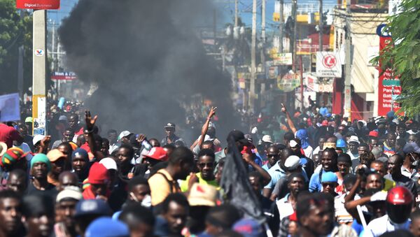 Demonstrators march during a protest demanding accountability from politicians for allegedly squandering billions of dollars in proceeds from Venezuela’s discounted PetroCaribe oil program in the streets of Port-au-Prince, on November 18, 2018, Investigations by the Haitian Senate in 2016 and 2017 concluded that nearly $2 billion from a Venezuelan aid program called Petrocaribe were misused. Through Petrocaribe, Venezuela for years supplied Haiti and other Caribbean and Central American countries with oil at cut-rate prices and on easy credit terms. - Sputnik International