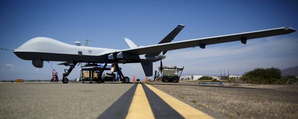 A General Atomics MQ-9 Reaper stands on the runway during Black Dart, a live-fly, live fire demonstration of 55 unmanned aerial vehicles, or drones, at Naval Base Ventura County Sea Range, Point Mugu, near Oxnard, California July 31, 2015 - Sputnik International