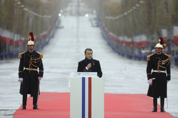 French President Emmanuel Macron delivers a speech during a ceremony at the Arc de Triomphe in Paris as part of the commemorations marking the 100th anniversary of the 11 November 1918 armistice, ending World War I, Sunday, Nov. 11, 2018 - Sputnik International