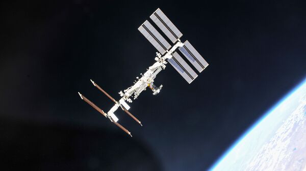 The International Space Station photographed by Expedition 56 crew members from a Soyuz spacecraft after undocking. NASA astronauts Andrew Feustel and Ricky Arnold and Roscosmos cosmonaut Oleg Artemyev executed a fly around of the orbiting laboratory to take pictures of the station before returning home after spending 197 days in space. The station celebrates the 18th anniversary of a continuous human presence and the 20th anniversary of the launch of the first element Zarya in November 2018. - Sputnik International