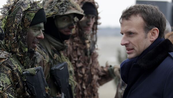 French President Emmanuel Macron inspects sniper squad as he attends a military exercise at the military camp of Suippes, near Reims, eastern France, Thursday, March 1, 2018 - Sputnik International