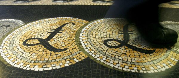 An employee is seen walking over a mosaic of pound sterling symbols set in the floor of the front hall of the Bank of England in London An employee is seen walking over a mosaic of pound sterling symbols set in the floor of the front hall of the Bank of England in London - Sputnik International