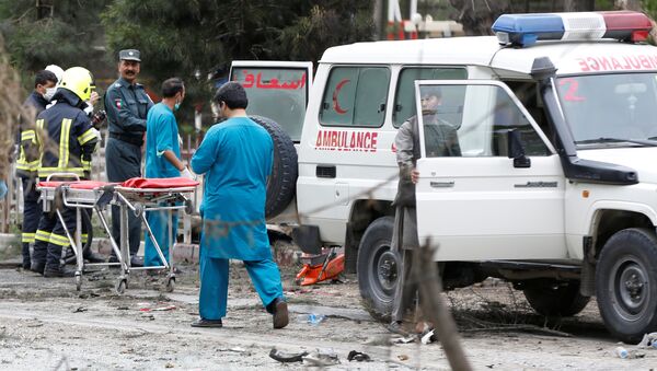 Afghan security forces and medics are seen at the site of a suicide attack in Kabul - Sputnik International