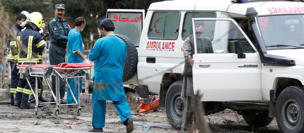 Afghan security forces and medics are seen at the site of a suicide attack in Kabul - Sputnik International
