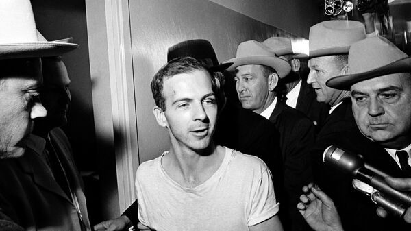 In this Nov. 23, 1963 file photo, surrounded by detectives, Lee Harvey Oswald talks to the press as he is led down a corridor of the Dallas police station for another round of questioning in connection with the assassination of U.S. President John F. Kennedy. Oswald, who denied any involvement in the shooting, was killed two days later, live on television, in the basement of the Dallas Police Headquarters, by local nightclub owner Jack Ruby.  - Sputnik International