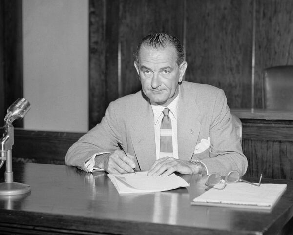 Sen. Lyndon B. Johnson, Blanco County Democratic chairman, signs the minutes of the county convention on May 8, 1956 at Johnson City, Tex. Sen. Lyndon B. Johnson, Blanco County Democratic chairman, signs the minutes of the county convention on May 8, 1956 at Johnson City, Tex. - Sputnik International