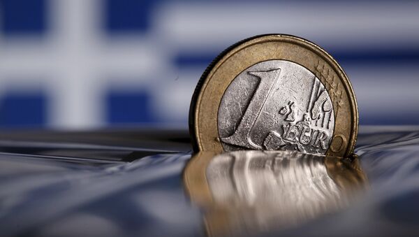 A one Euro coin is seen in this file photo illustration taken in Rome, Italy - Sputnik International
